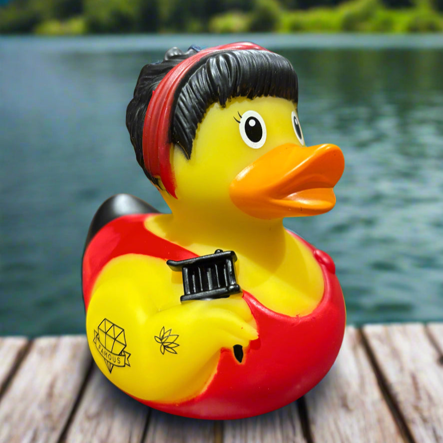 Rubber duck with a tattoo on a black surface