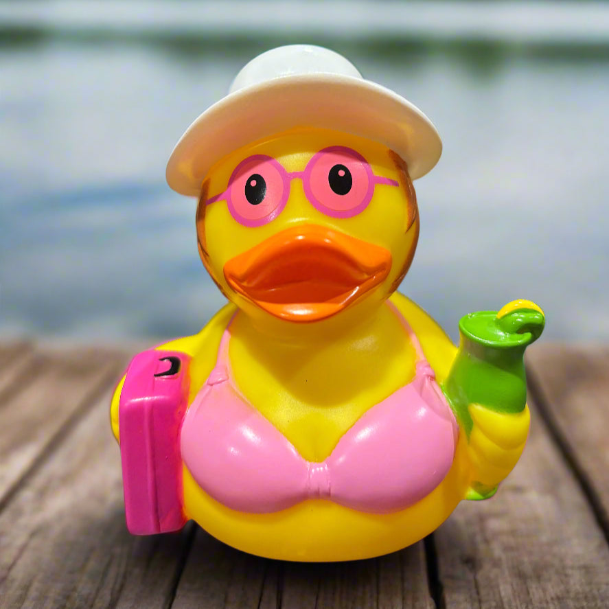 Colorful rubber duck-shaped object on a dark surface with a blurred background